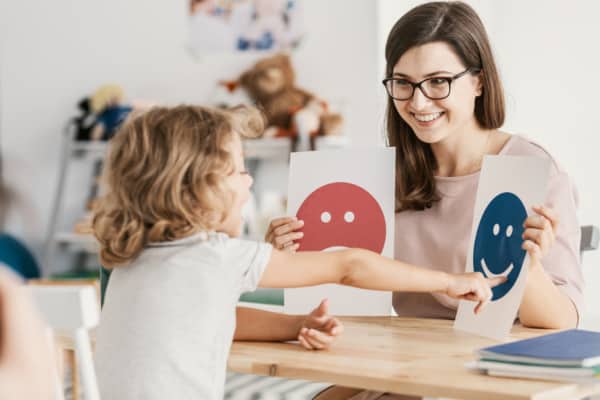 Children’s Counseling Techniques Emotion emoticons used by a psychologist during a therapy session with a child.